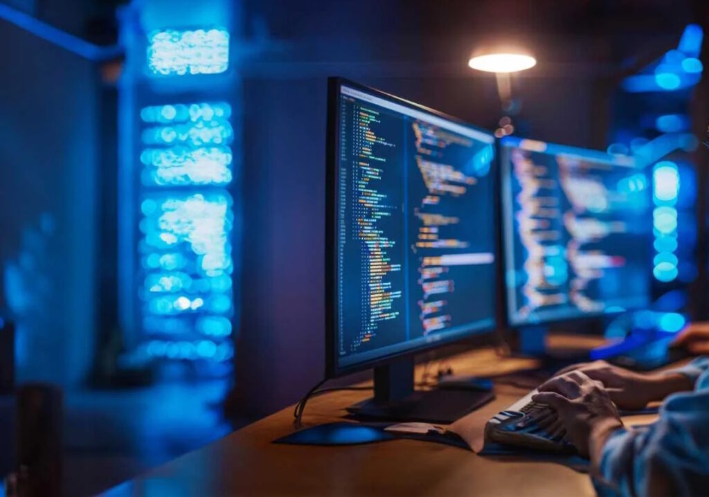 computer analyst reviewing code in a tech office
