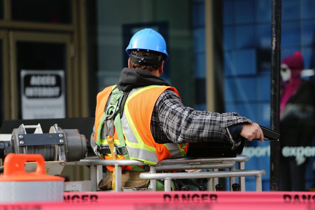 construction worker wearing a blue helmet and safety vest
